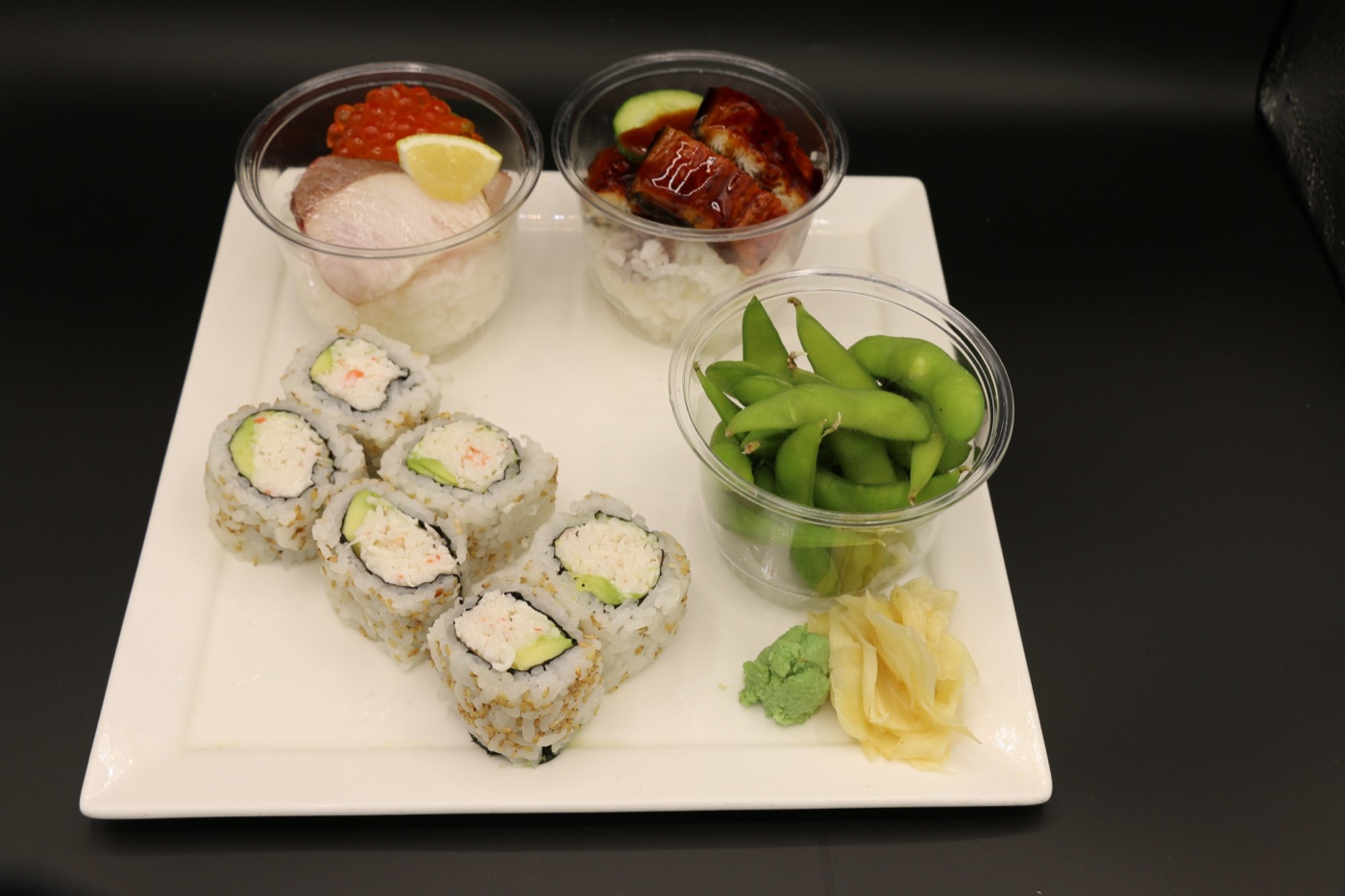 Orenchi sushi set — cup sushi, a California-style roll, and edamame on a white plate